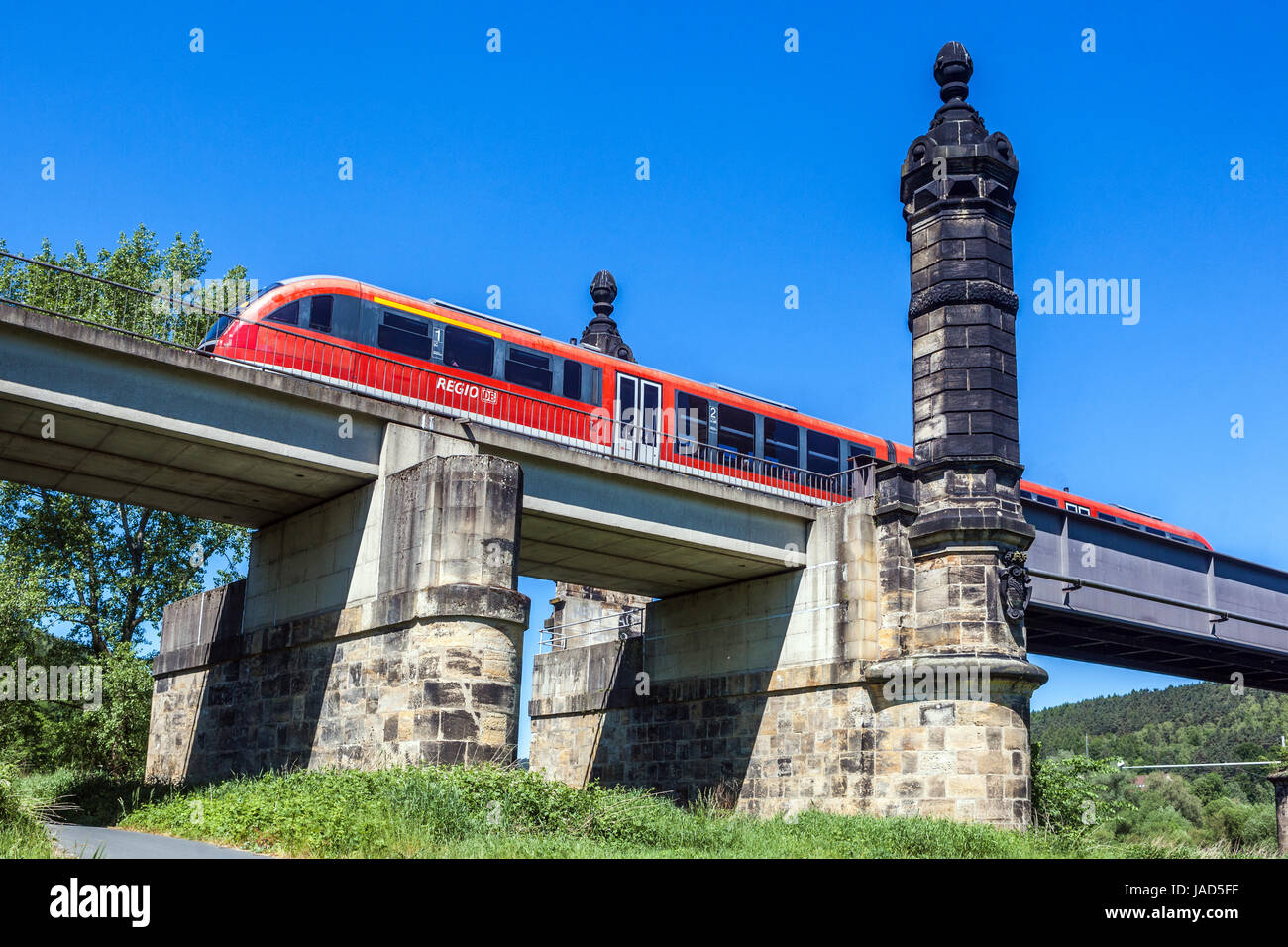 Regional train passing railway bridge, Bad Schandau, Saxon Switzerland Germany Elbe valley bridge Stock Photo