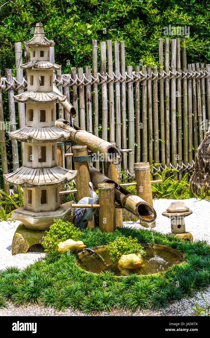 Pagada Stone And Bamboo Fountain In Japanese Garden Stock Photo
