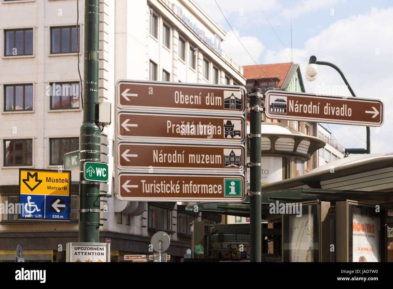 A signpost giving directions in Prague, including for tourist information Stock Photo