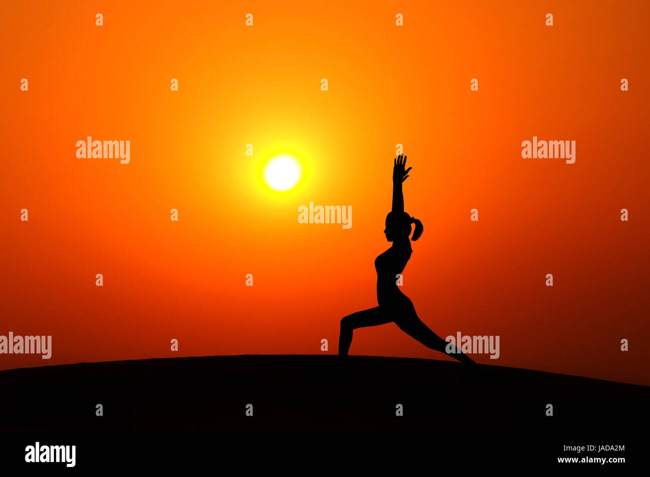 Silhouette of woman doing yoga meditation during sunset with natural ...