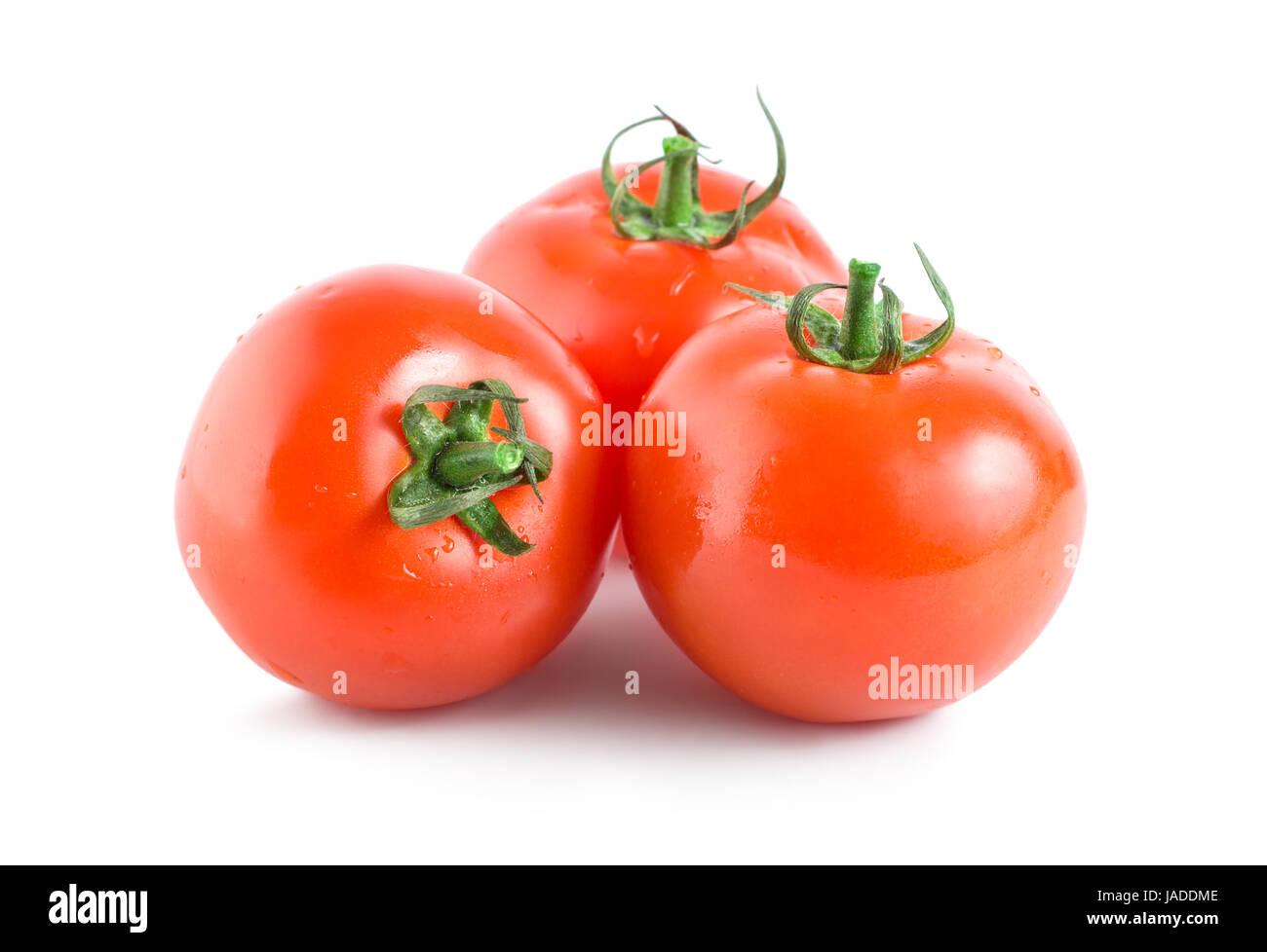 Three red tomatoes isolated on white background Stock Photo - Alamy