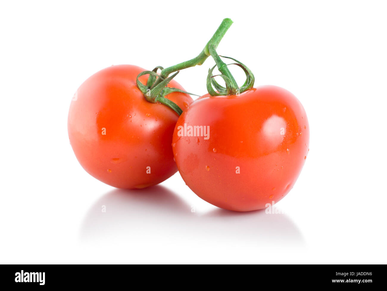 Two ripe tomatoes isolated on white background Stock Photo - Alamy