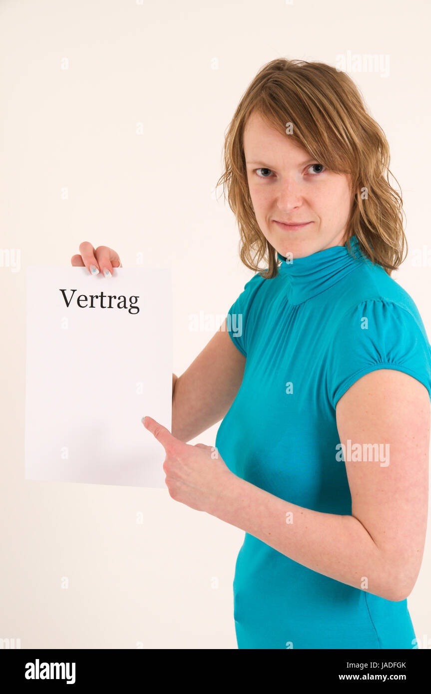 blond woman show with her index finger to the blank contract; junge blonde Frau zeigt mit dem Zeigefinger auf einen leeren Vertrag Stock Photo