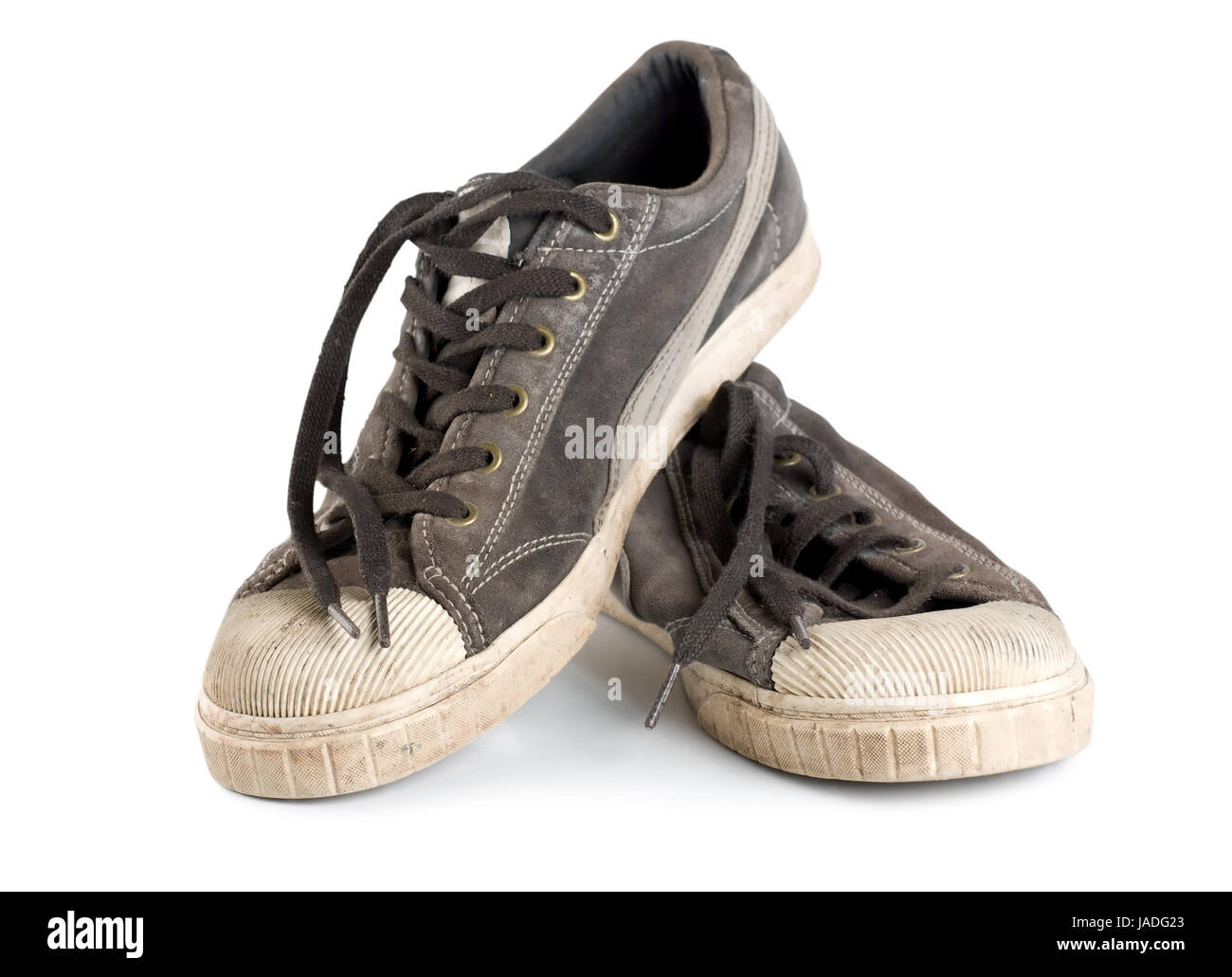 Old dirty sneakers isolated on white background Stock Photo - Alamy
