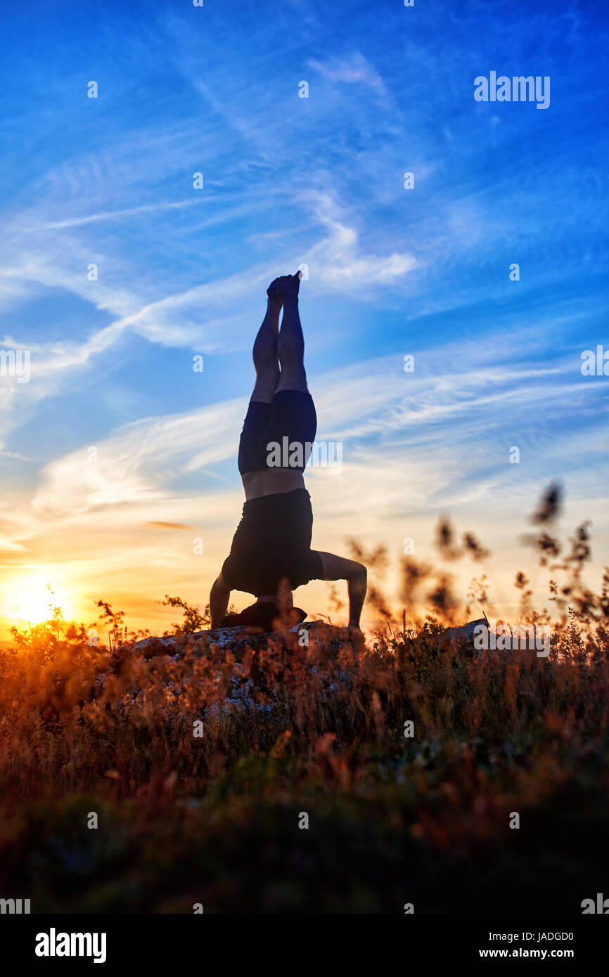 Young man stretching arm sunrise hi-res stock photography and images ...