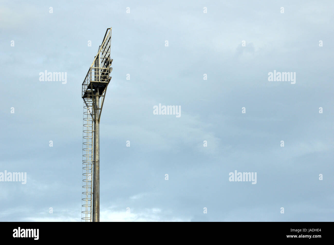 stadium light poles with white clouds and blue sky backgrounds Stock