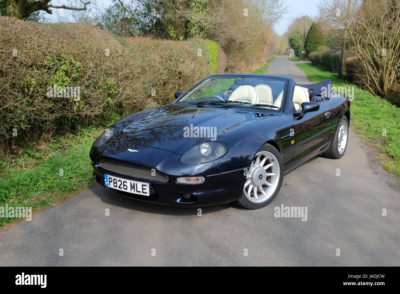 Aston Martin DB7 convertible parked on country lane in Autumn Stock Photo