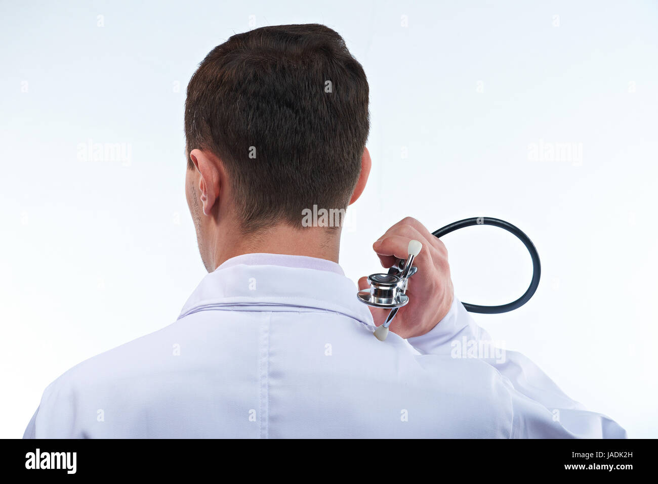 Man doctor hold stethoscope closeup isolated on white background Stock Photo