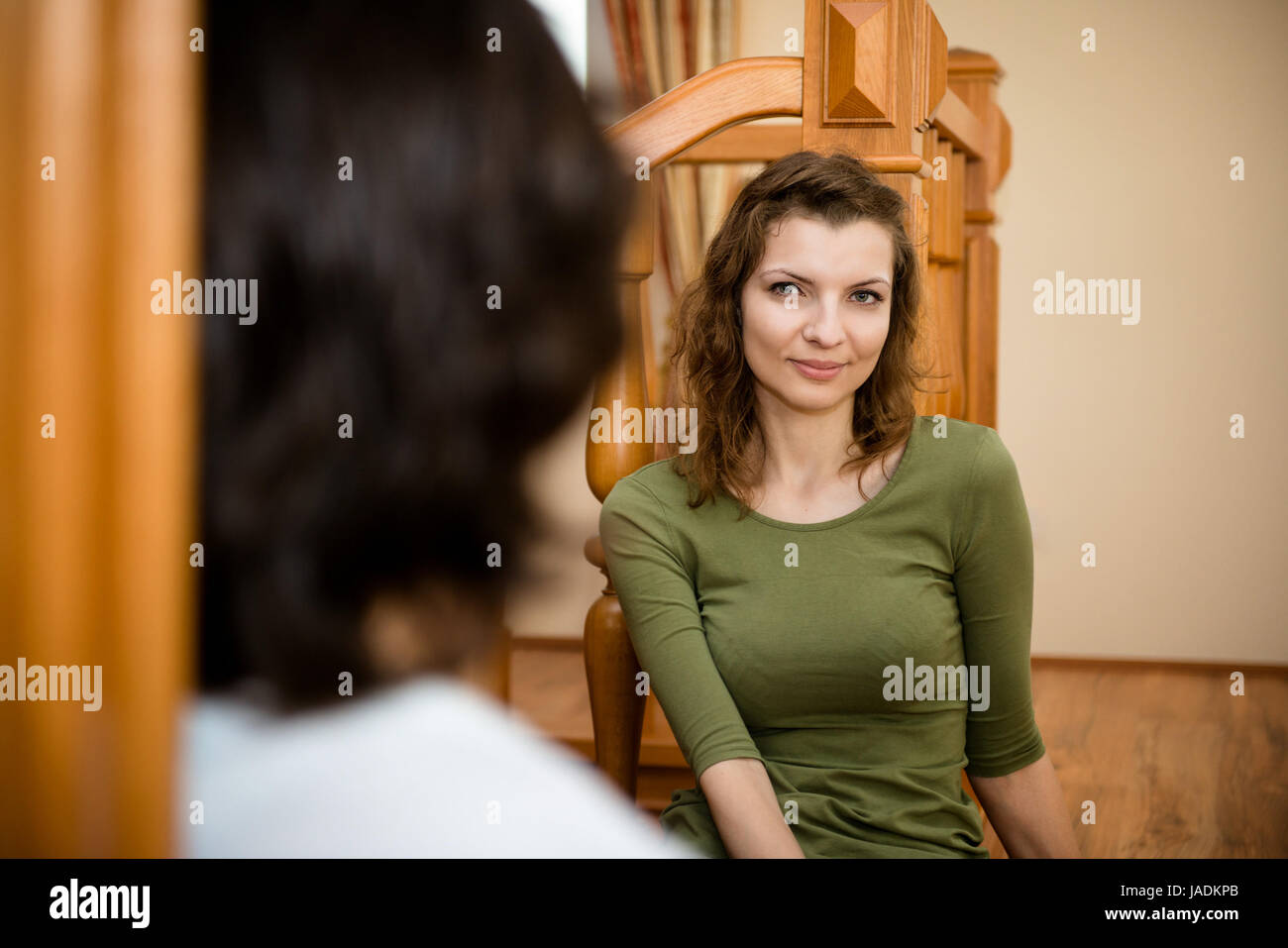 Portrait of young smiling woman - view over shoulder of man Stock Photo ...