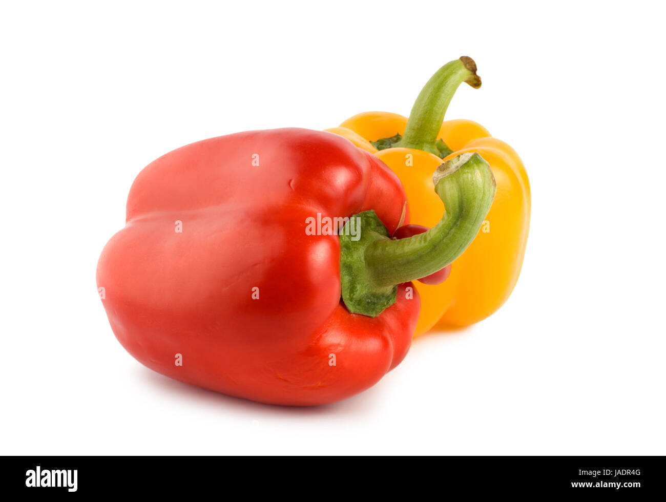 Yellow and red pepper isolated on white background Stock Photo - Alamy