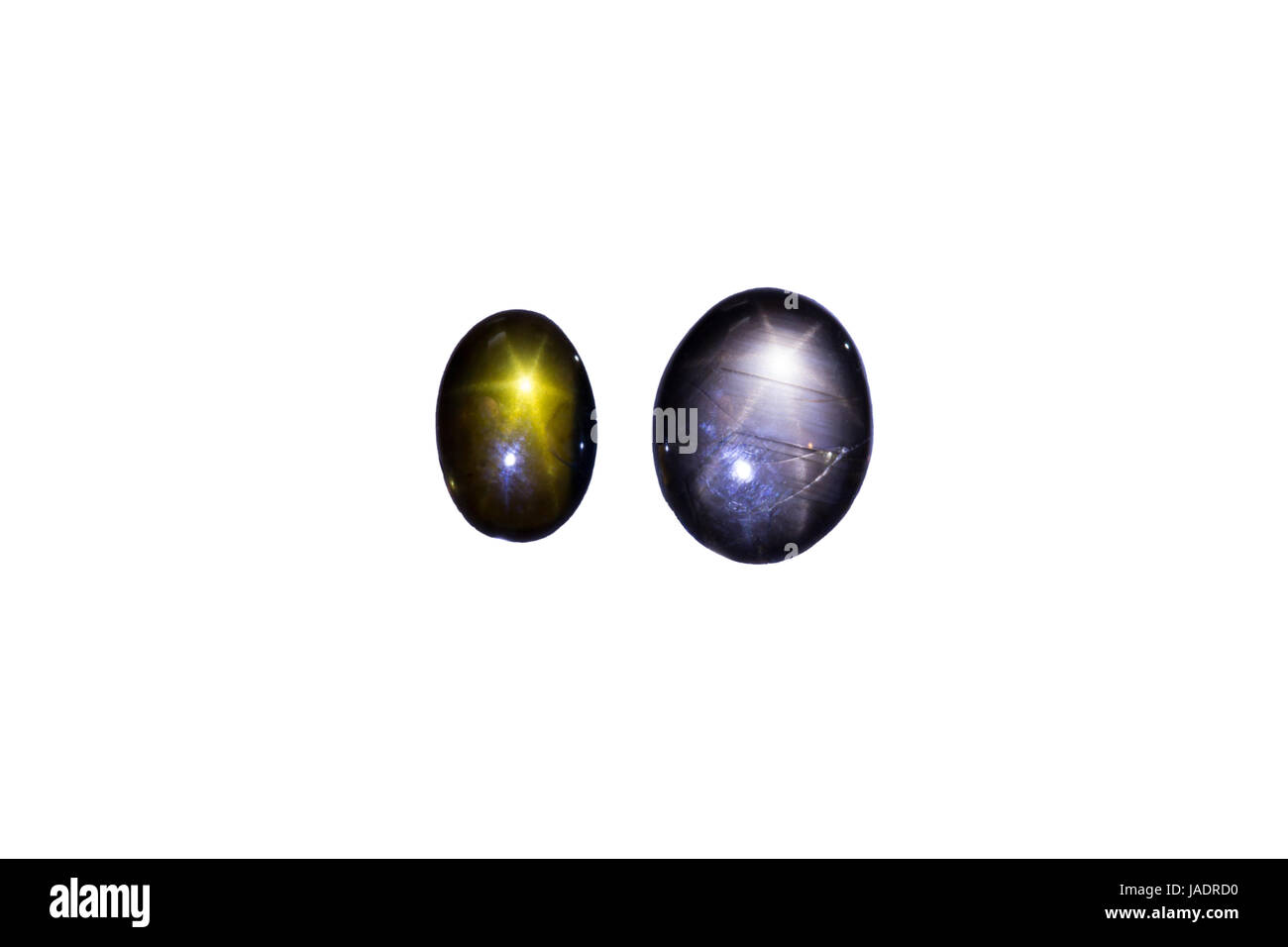 Zwei Saphire mit sternförmiger Lichtreflektion, freigestellt Stock Photo