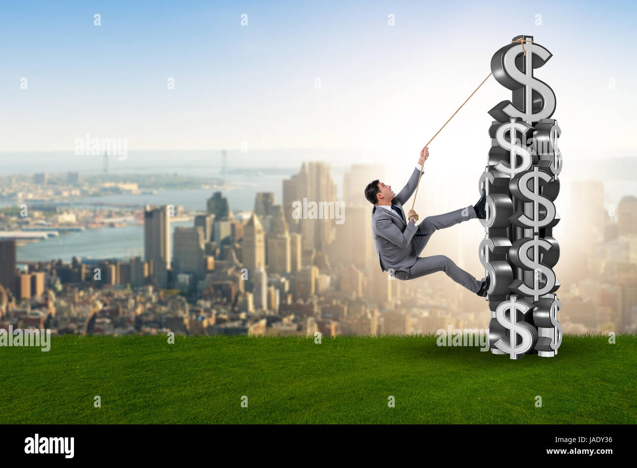 Businessman climbing dollar challenge tower Stock Photo Alamy