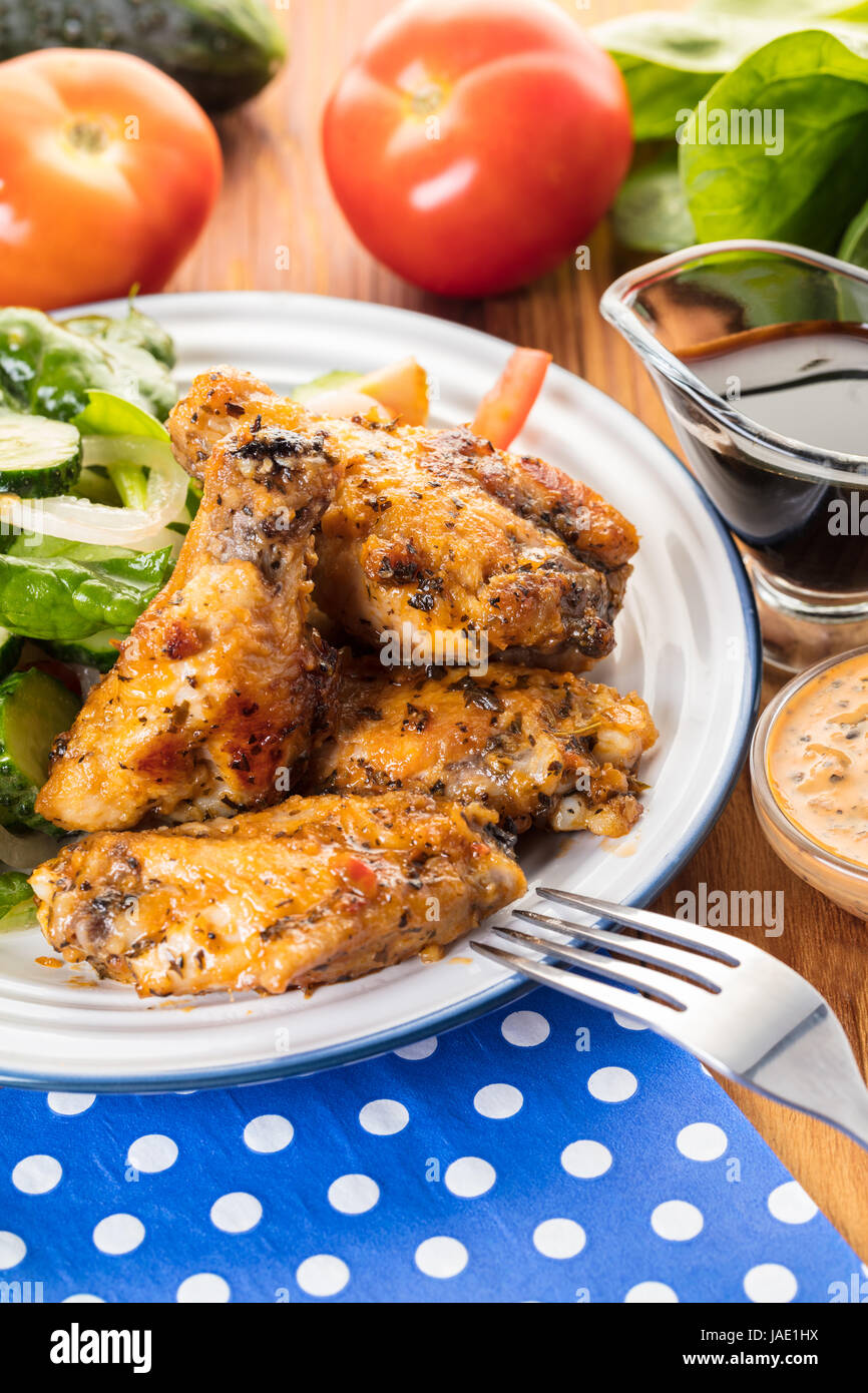 Chicken wings in sauce with fresh vegetables Stock Photo Alamy