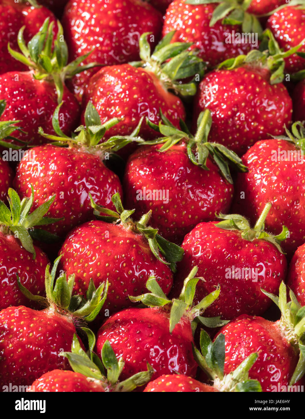 Berry background from a fresh strawberry texture closeup Stock Photo ...