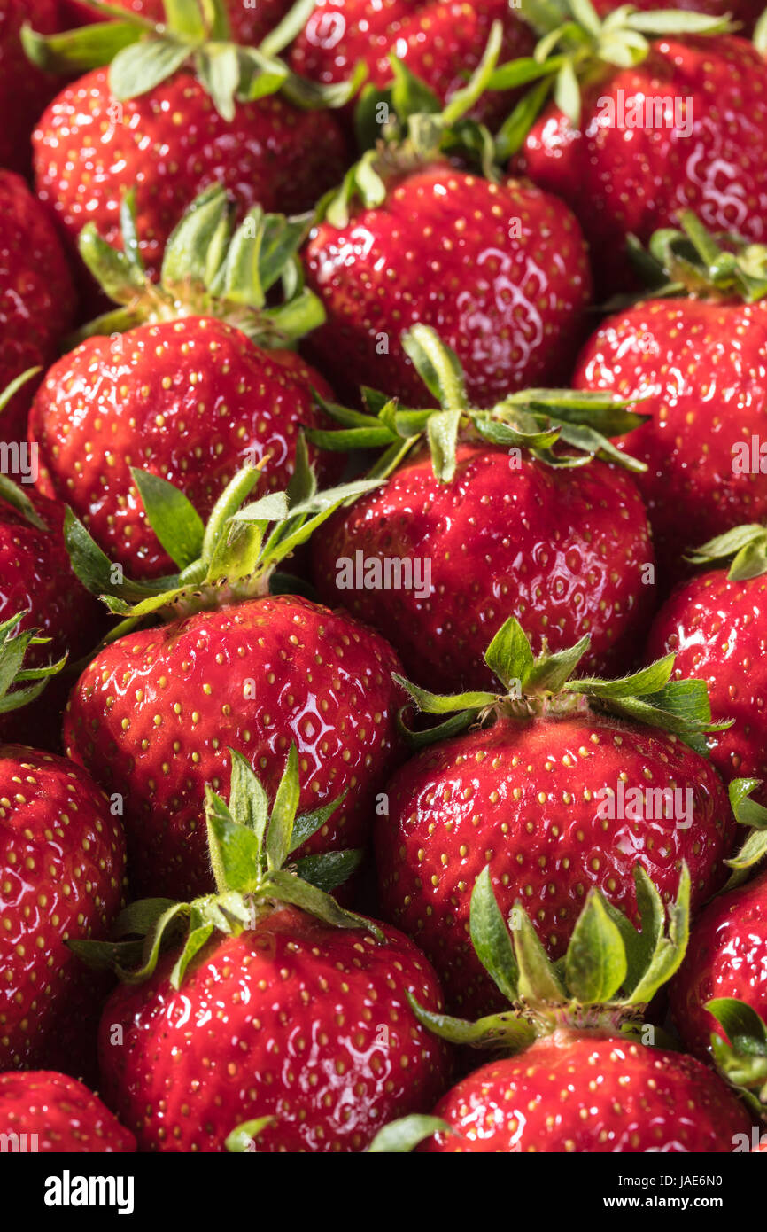 Berry background from a fresh strawberry texture closeup Stock Photo ...