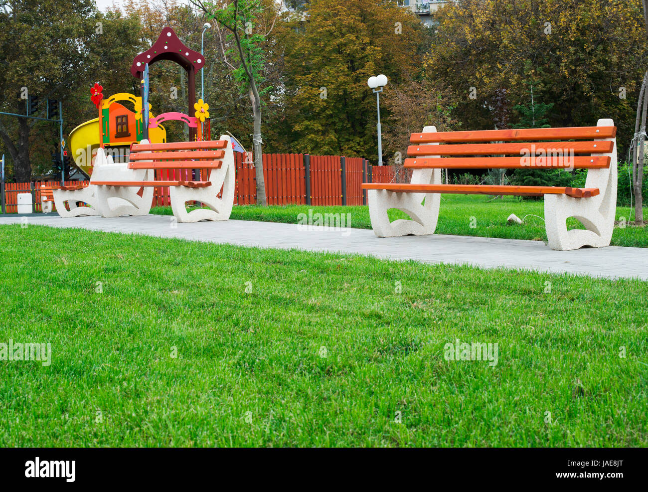 New wooden benches in a park Stock Photo - Alamy