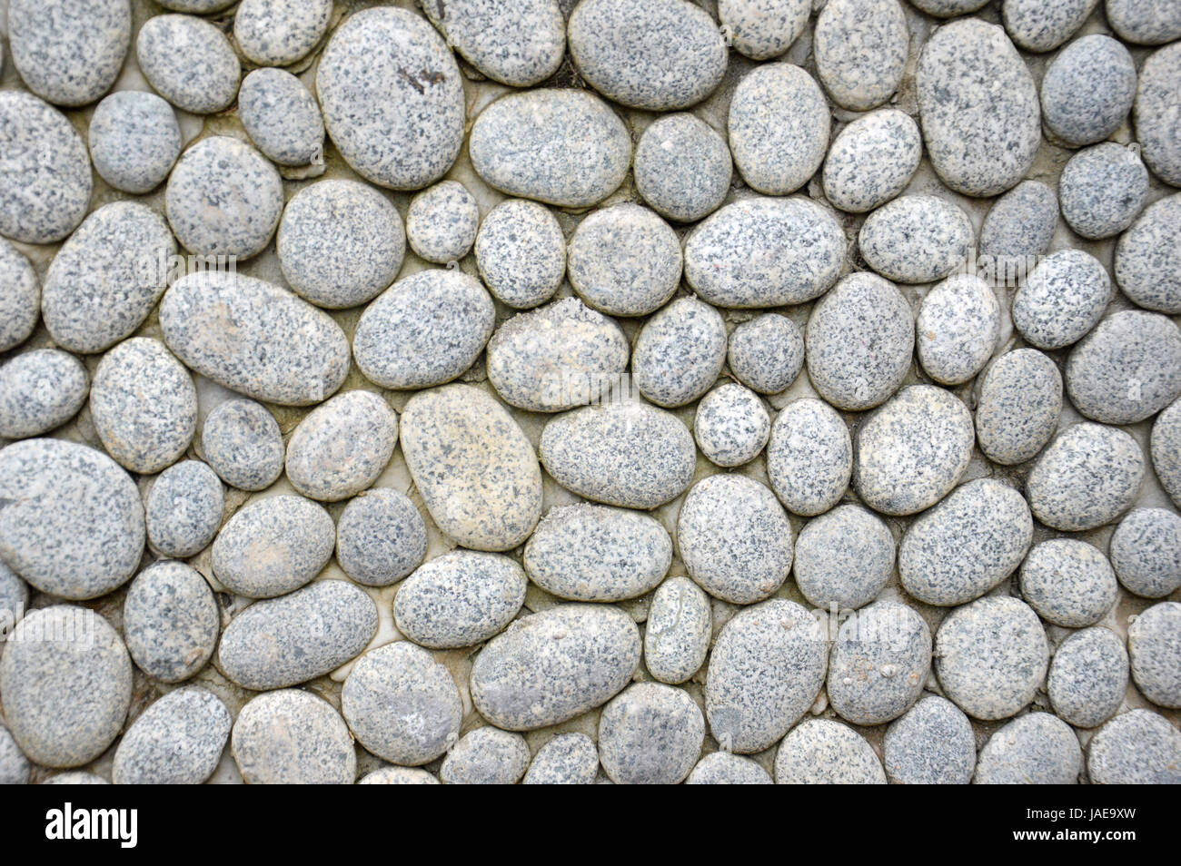 pebbles wall background Stock Photo - Alamy