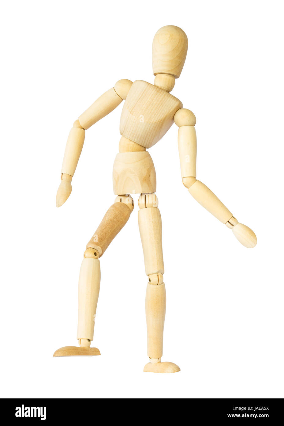 Wooden puppet is dancing . Isolated background . Stock Photo