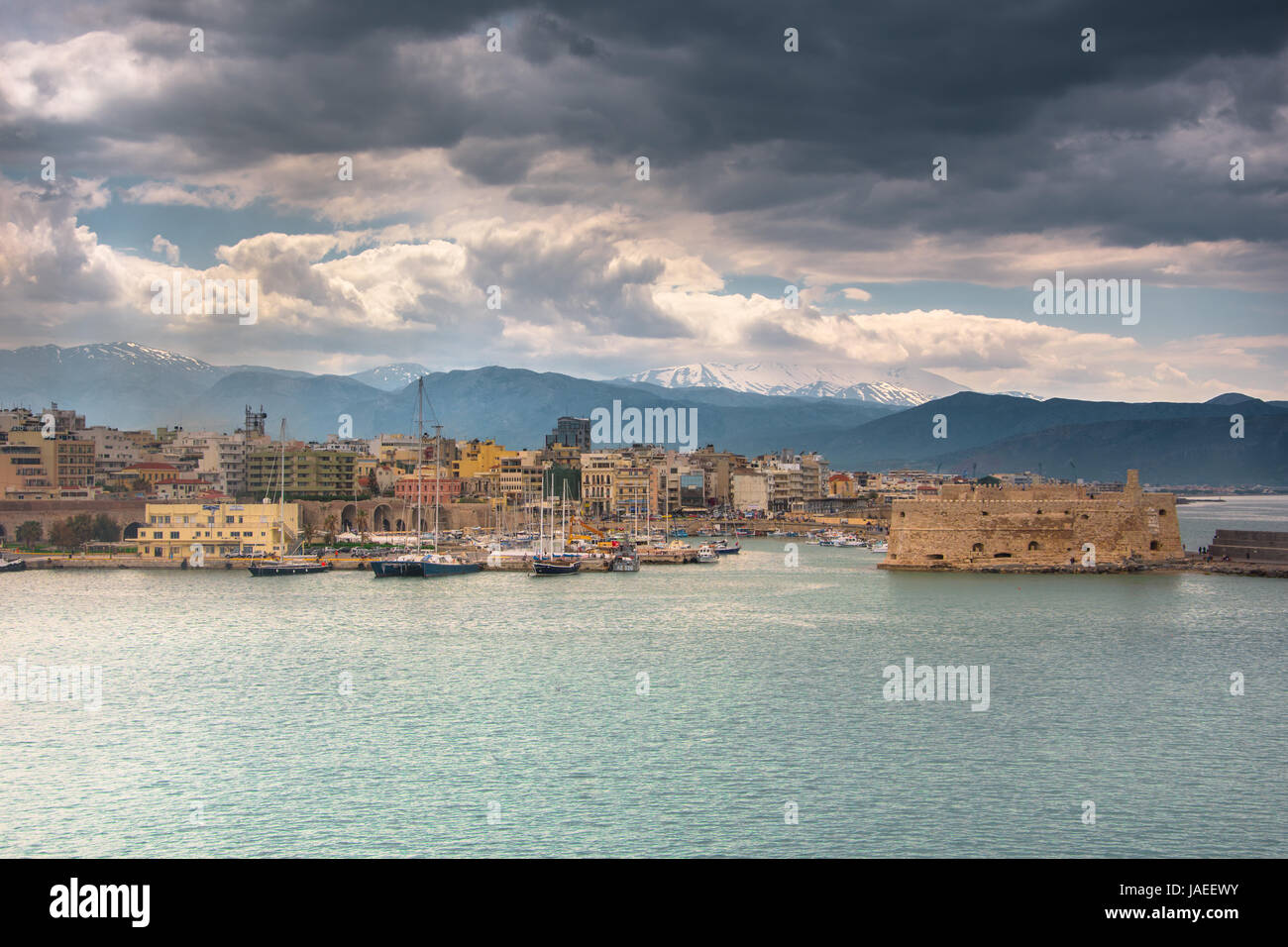 Old harbour of Heraklion with Venetian Koules Fortress, boats and marina at night, Crete, Greece. Stock Photo