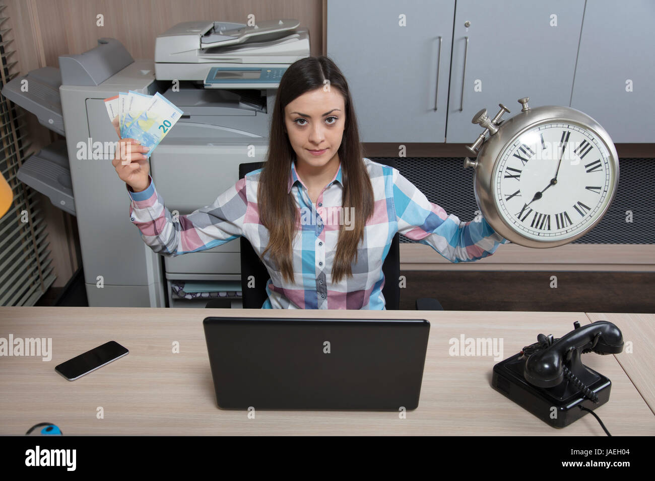 Time is money, according to business woman Stock Photo - Alamy
