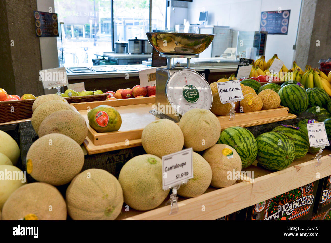 Cantaloupes, watermelons and other fruit on display and for sale in grocery store in San Francisco, California Stock Photo