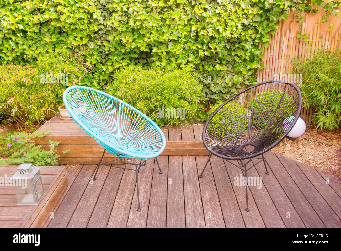 Two garden chairs in a small modern urban patio Stock Photo