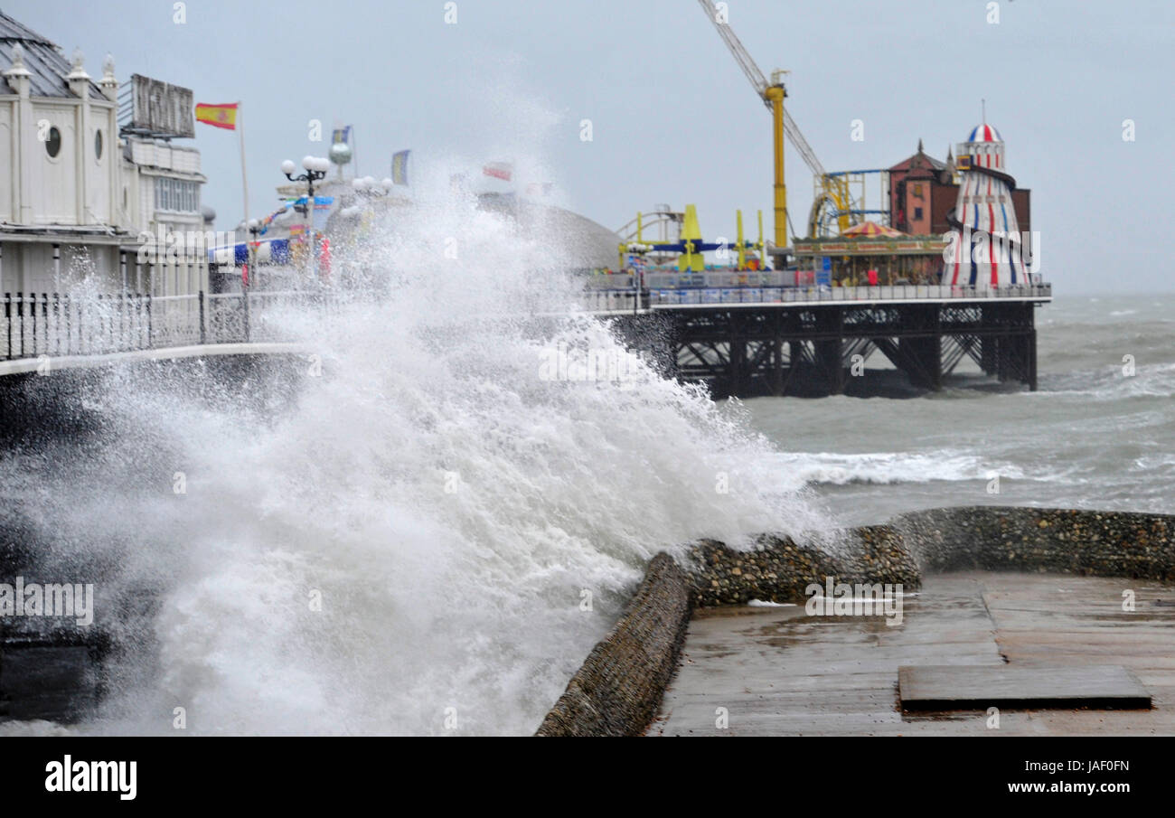 Brighton, UK. 6th June, 2017. Huge waves crash on to Brighton seafront by the Palace Pier as storms with high winds and driving rain batter the south coast of Britain today with more unsettled weather forecast for the next few days Credit: Simon Dack/Alamy Live News Stock Photo