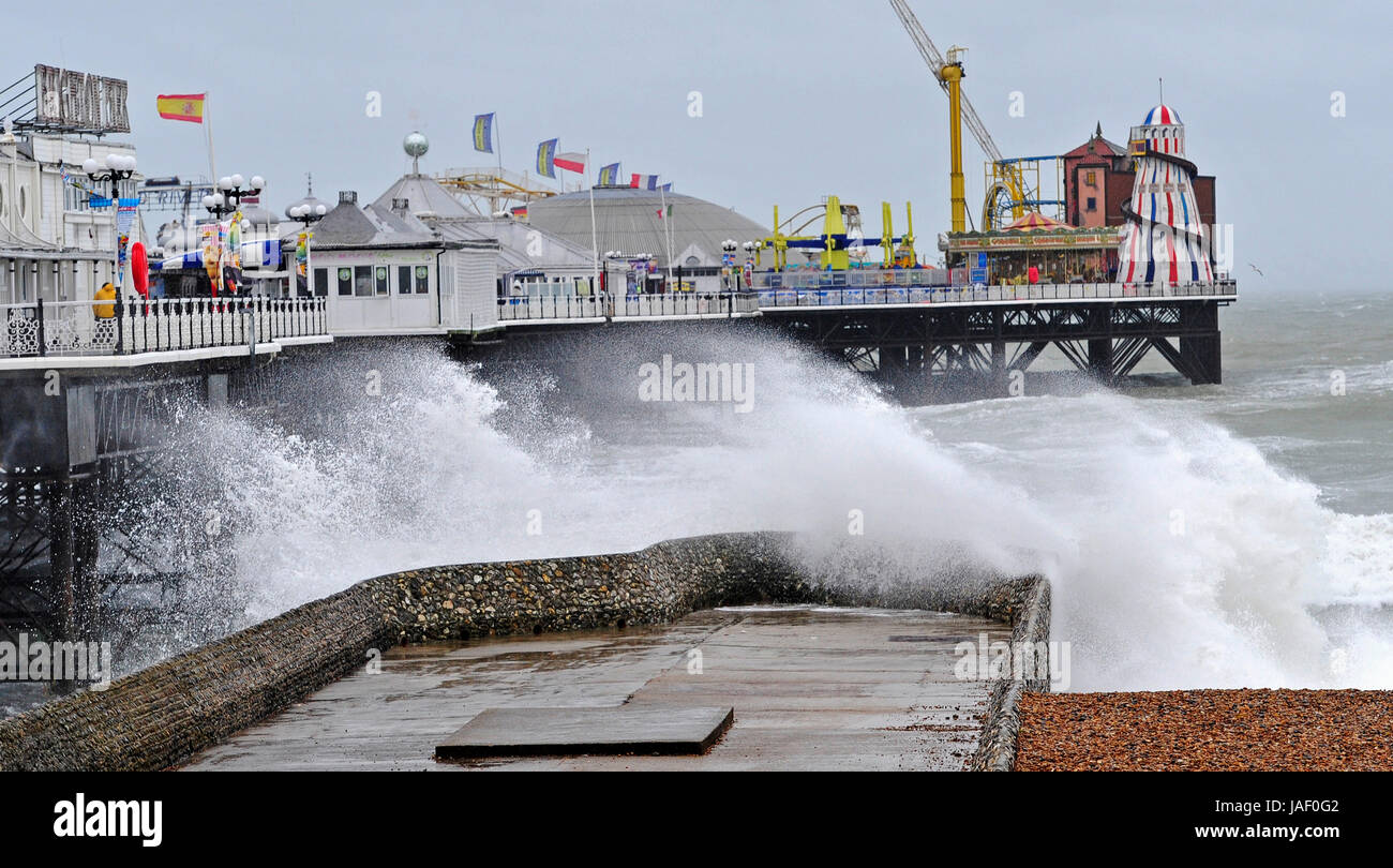 Brighton, UK. 6th June, 2017. Huge waves crash on to Brighton seafront by the Palace Pier as storms with high winds and driving rain batter the south coast of Britain today with more unsettled weather forecast for the next few days Credit: Simon Dack/Alamy Live News Stock Photo