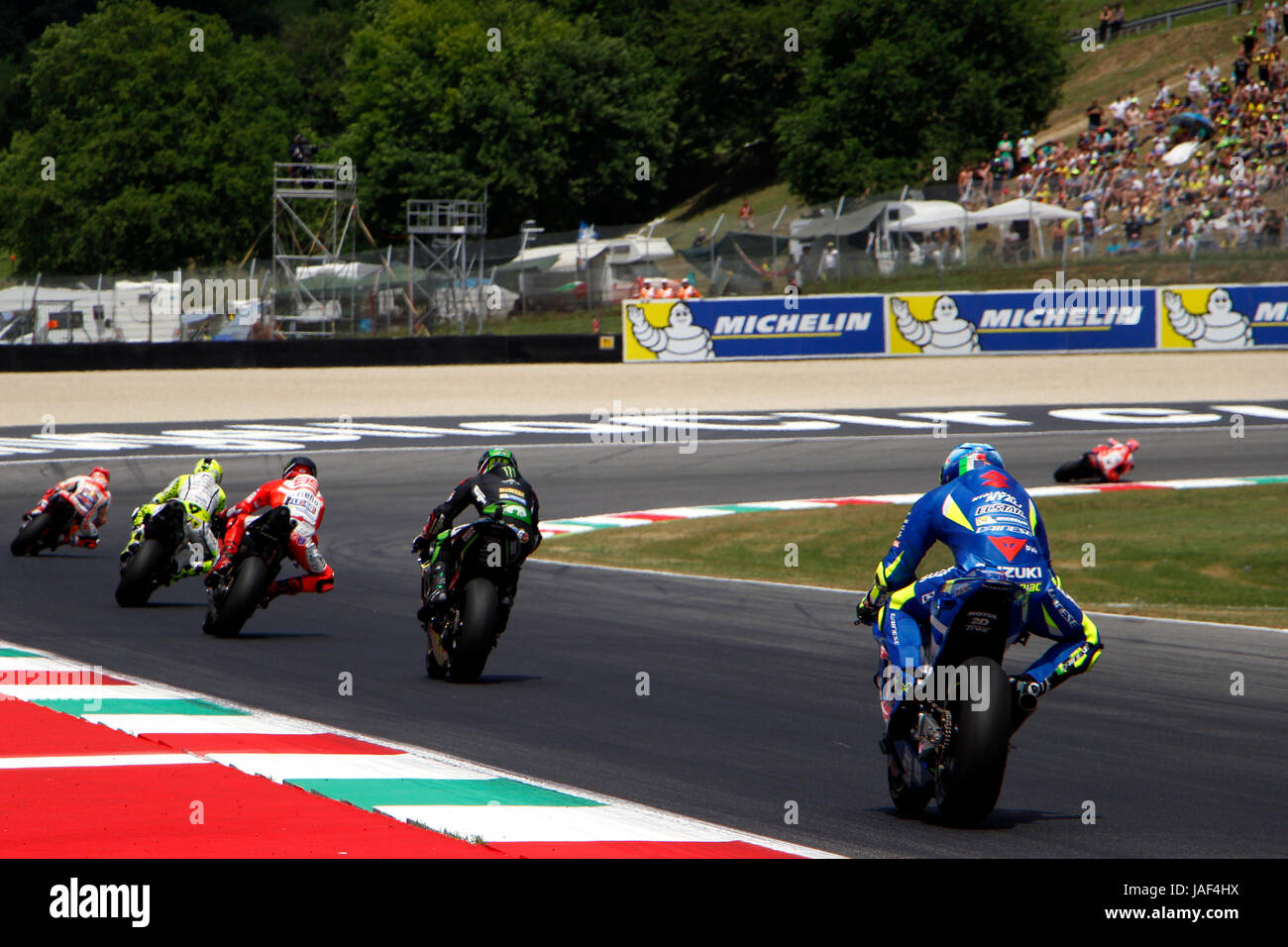 Florence, Italy. 04th June, 2017. A pack of MotoGP bikes approach the first  corner, San Donato, at the Mugello Circuit at the 2017 Italian Motorcycle  Grand Prix. Credit: Joseph Suschitzky/Alamy Live News