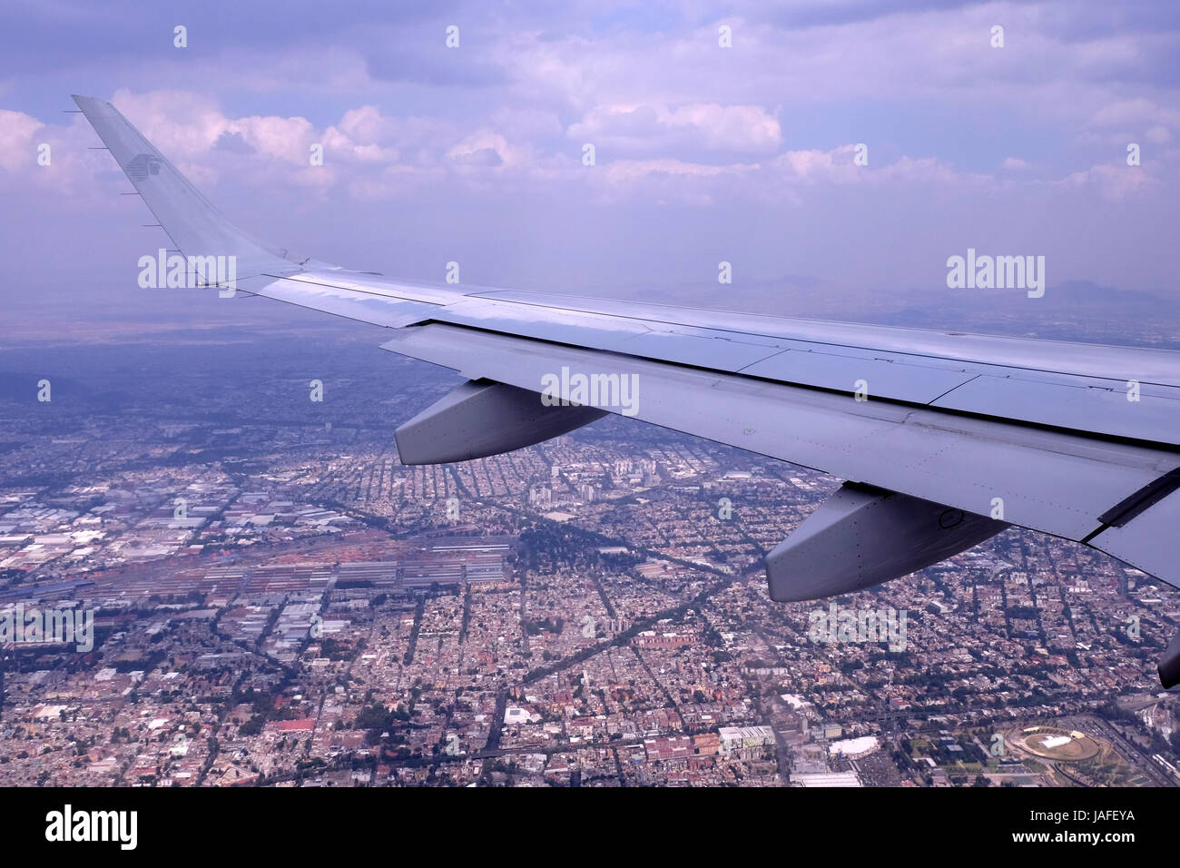Wing of Aeromexico, the flag carrier airline of Mexico over Mexico city Stock Photo