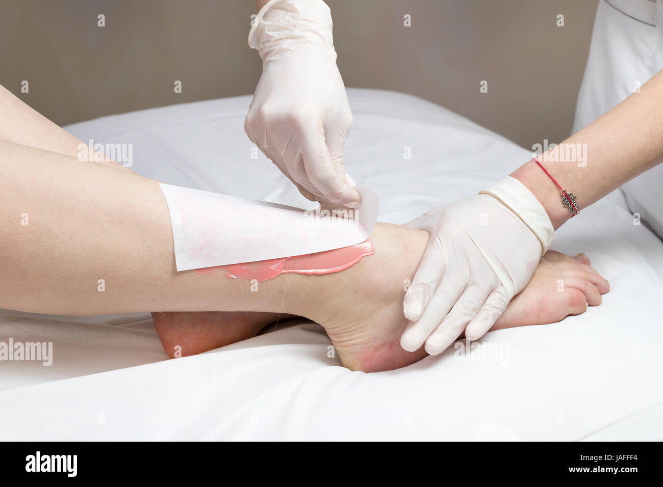 Process depilation female legs and hands in a beauty salon Stock Photo