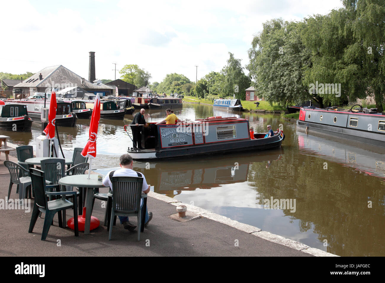 A narrowboat about to set off from Norbury Junction on the Shropshire Union Canal Stock Photo