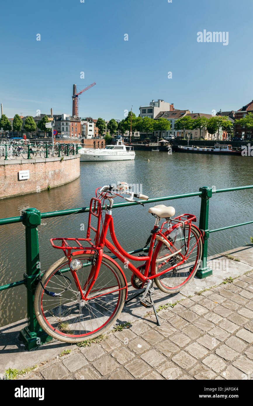 Red bycicle  parked near the  Portus Ganda yacht marina  - Ghent, Flanders, Belgium Stock Photo