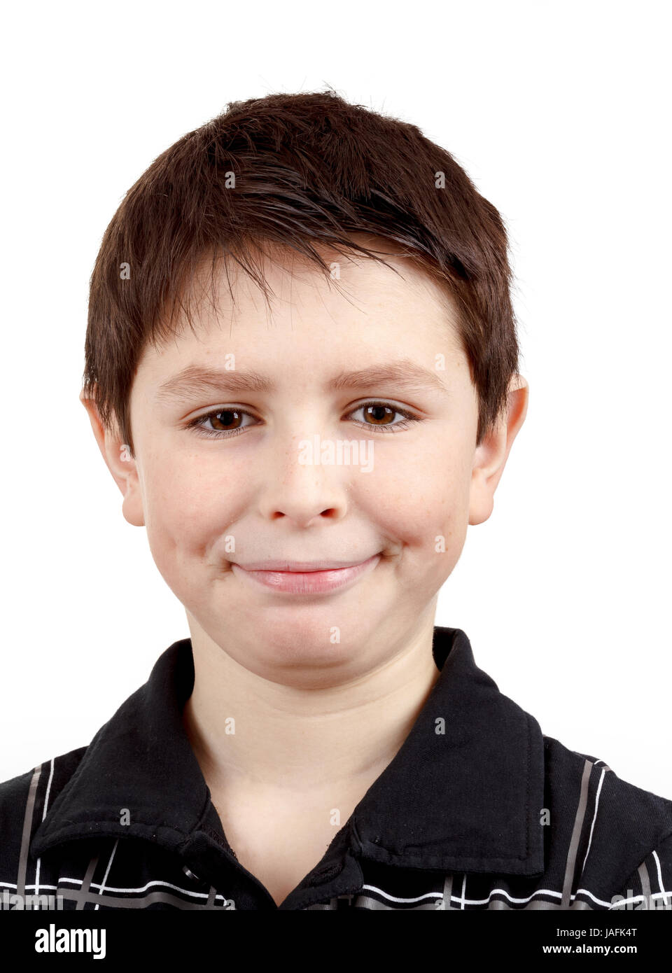 Portrait of a happy smiling young boy against white background Stock ...