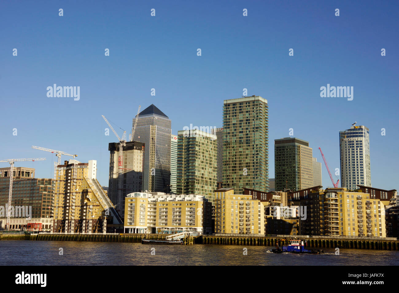 Tall modern finance buildings near Thames river in London UK Stock Photo