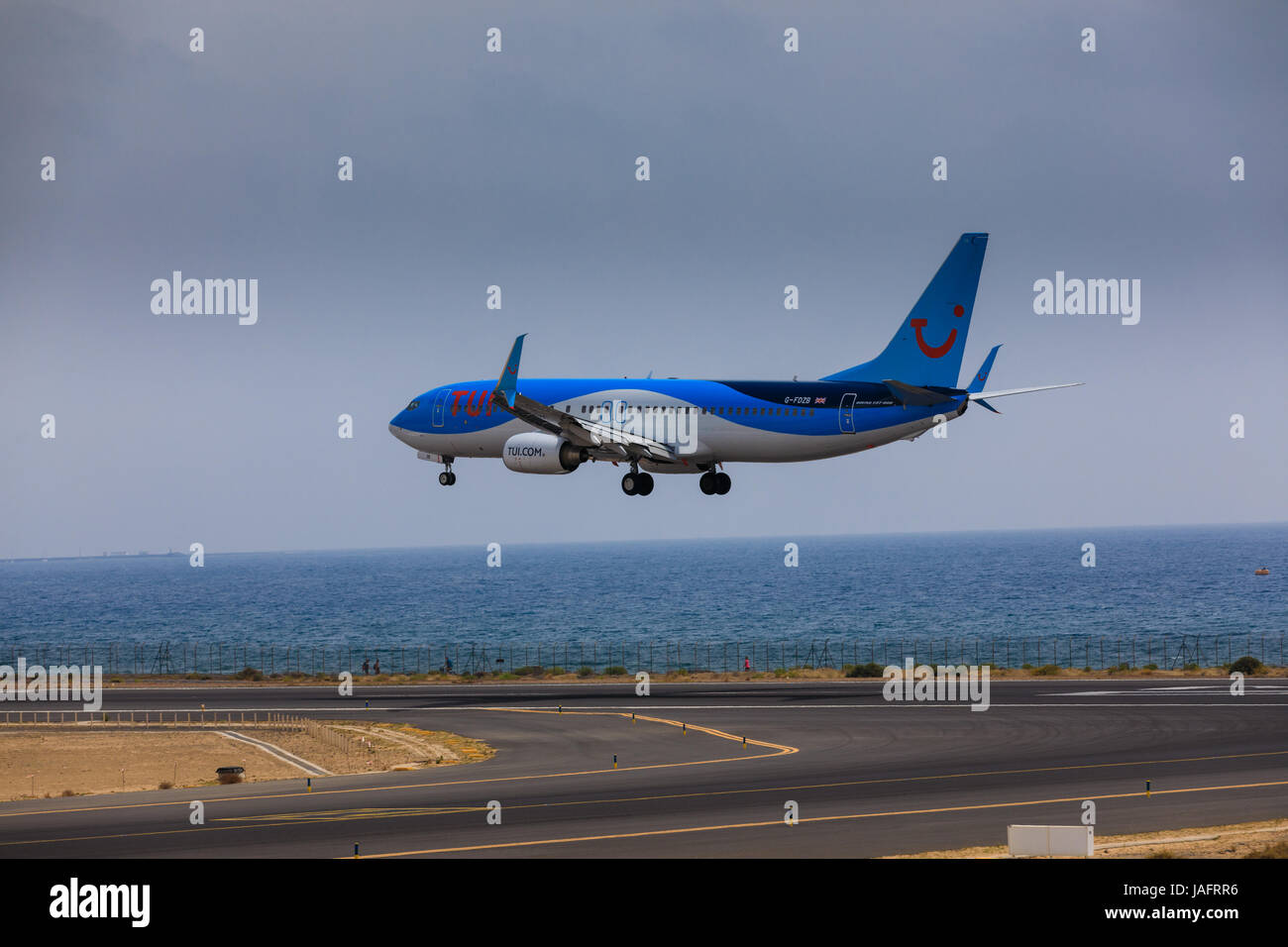 ARECIFE, SPAIN - APRIL, 16 2017: Boeing 737-800 of TUI with the registration G-FDZB landing at Lanzarote Airport Stock Photo