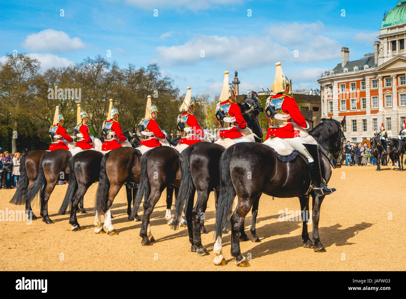 The Royal Guards in red uniform on horses, The Life Guards, Household Cavalry Mounted Regiment, parade ground Horse Guards Stock Photo
