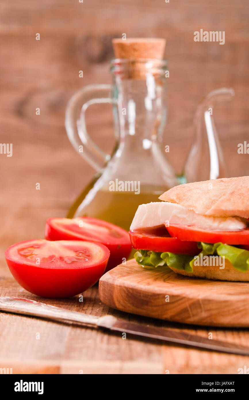 Puccia bread with mozzarella and tomato Stock Photo - Alamy