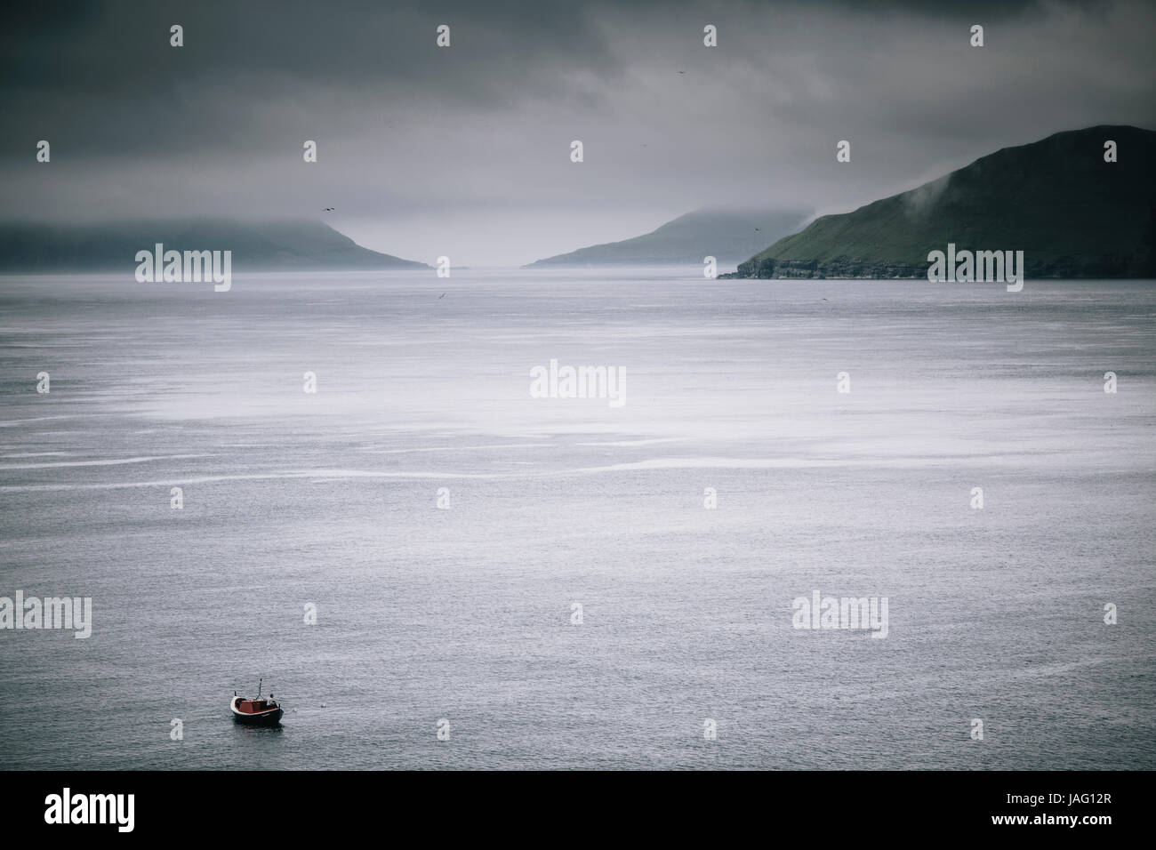 Faroe Islands - July 26, 2014. A small boat in the beautiful Faroe Islands. Stock Photo