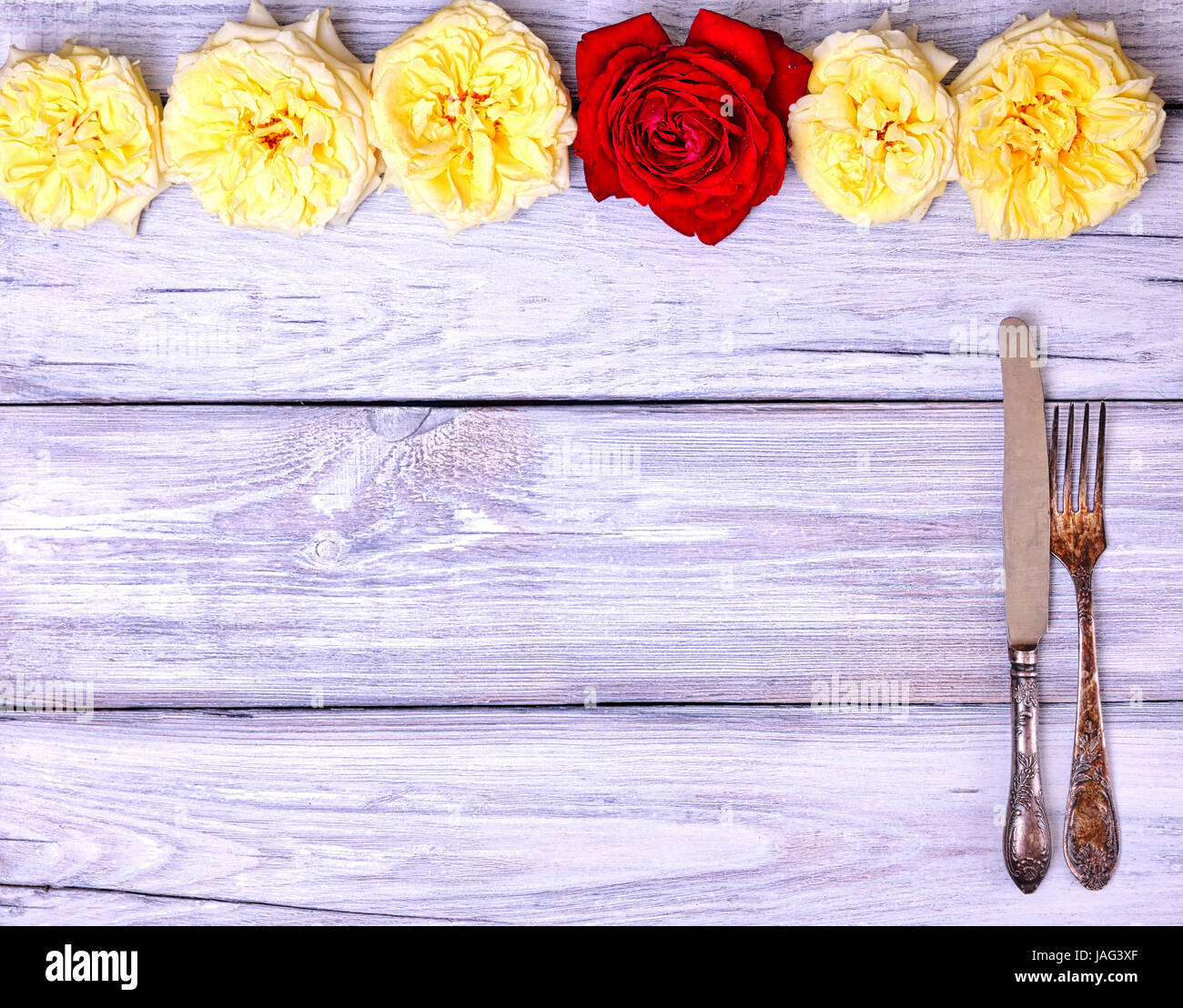 Vintage cutlery fork and knife on a white wooden background, blank space, top view Stock Photo