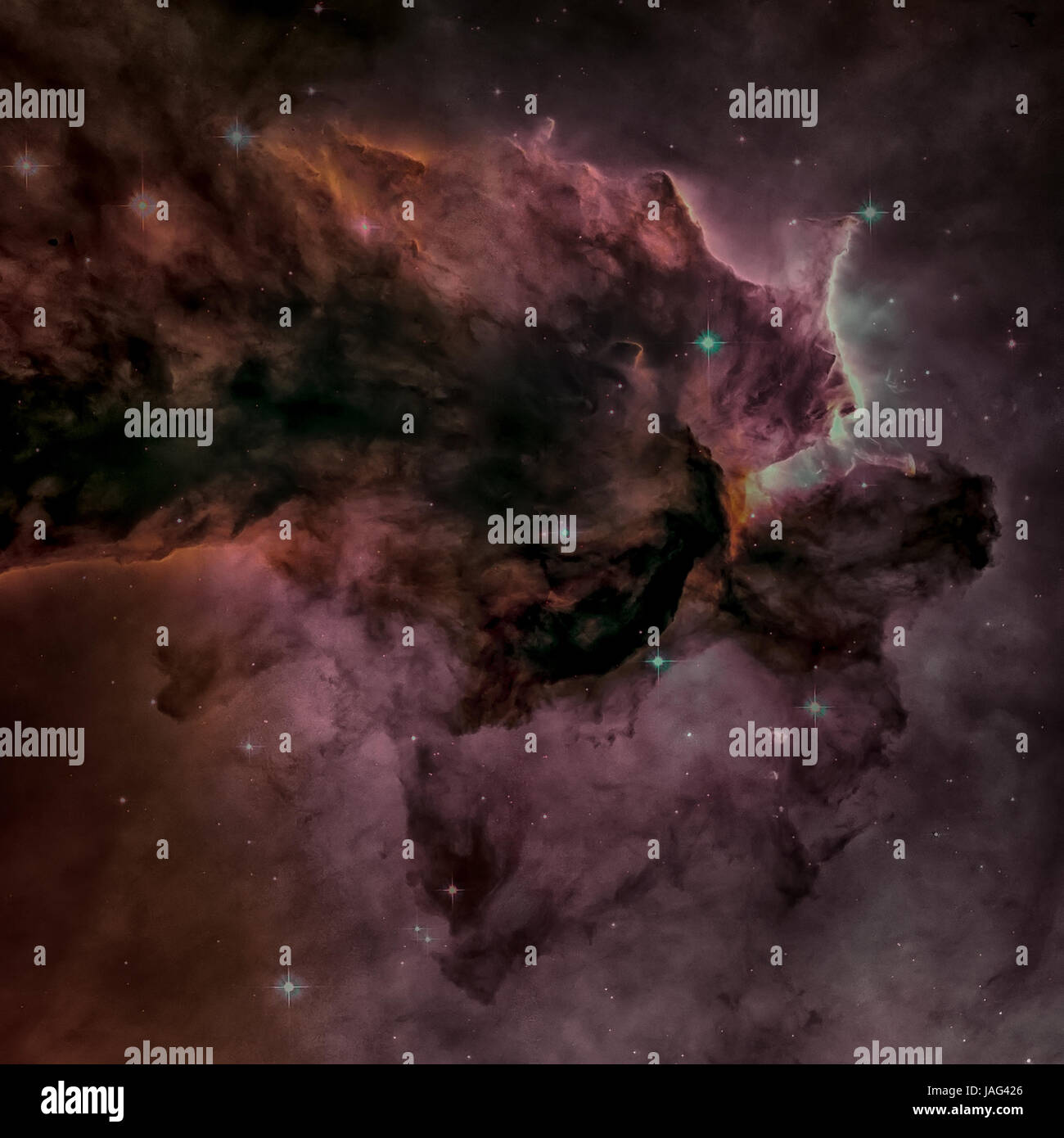 A billowing tower of gas and dust rises from the stellar nursery known