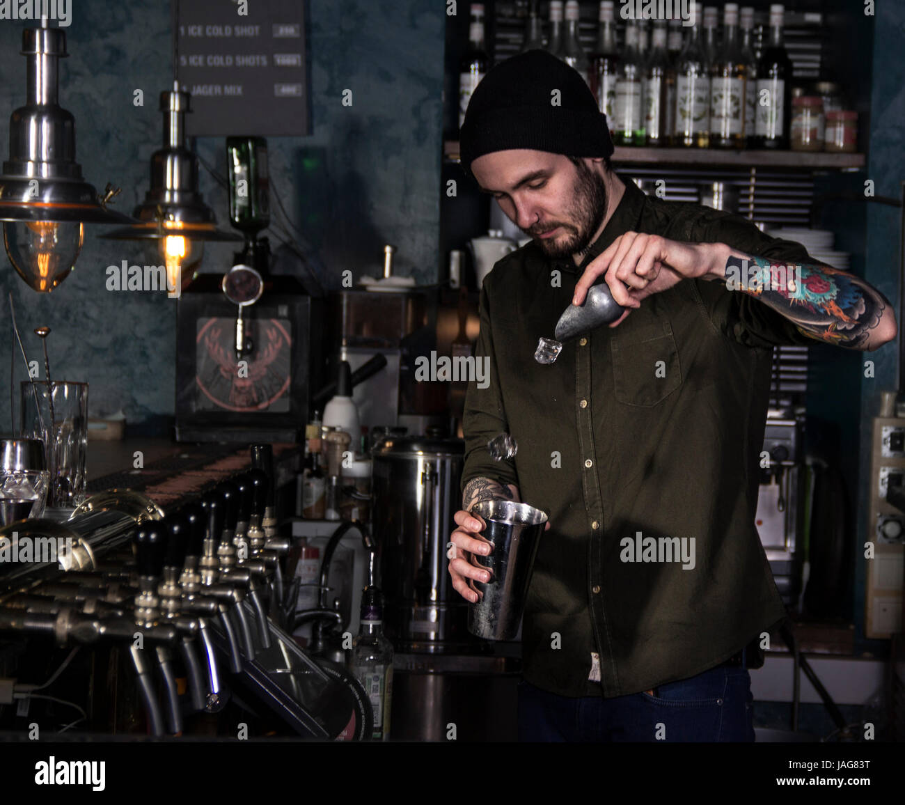 Attractive bartender is making a cocktail in a bar Stock Photo - Alamy