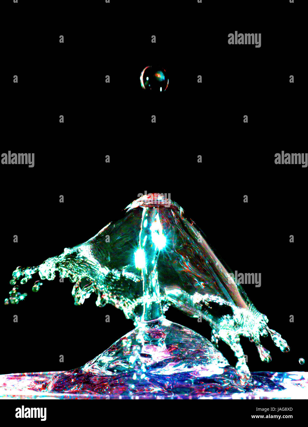 Colorful liquid splash isolated on black background closeup Stock Photo ...