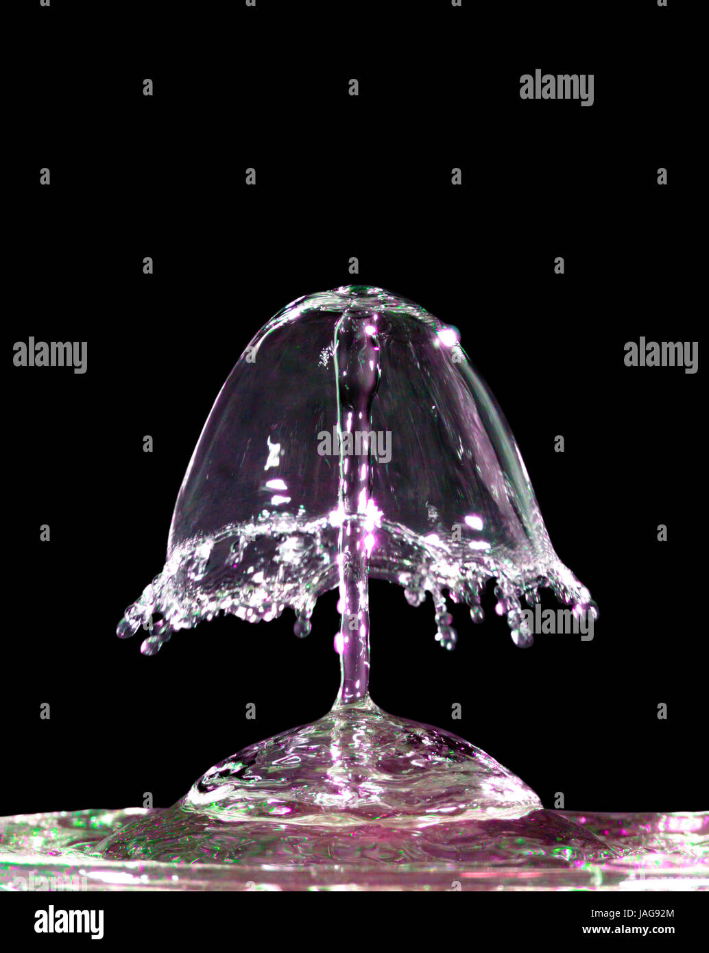 Colorful liquid splash isolated on black background closeup Stock Photo ...