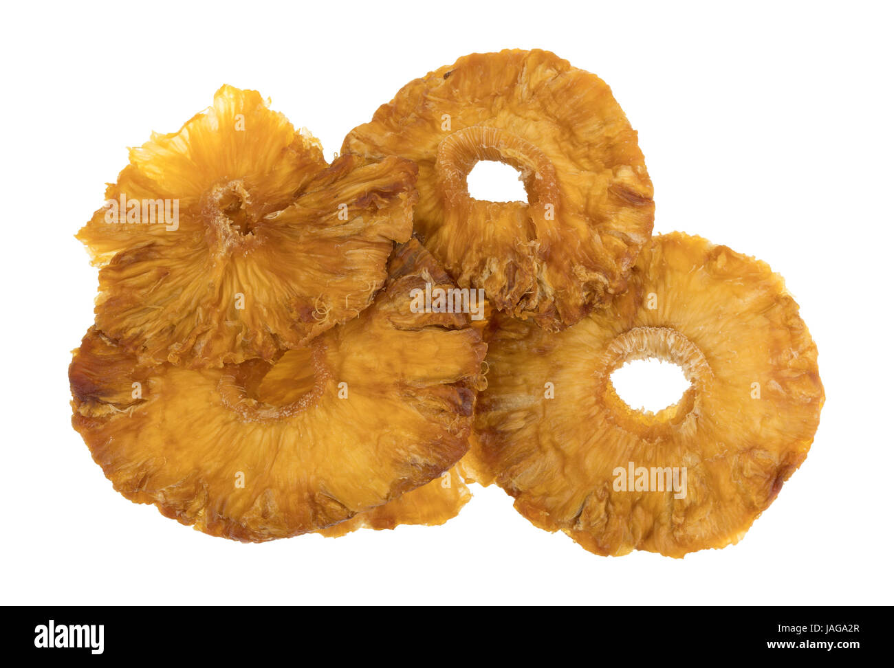 Top view of a close group of sun dried pineapple slices isolated on a white background Stock