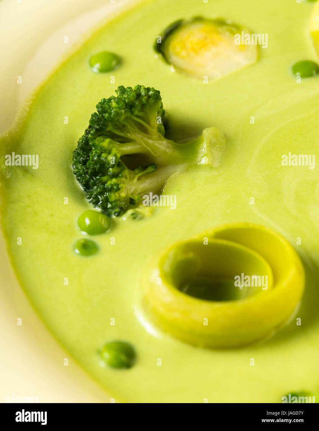 cream soup puree of green peas with vegetables closeup Stock Photo - Alamy