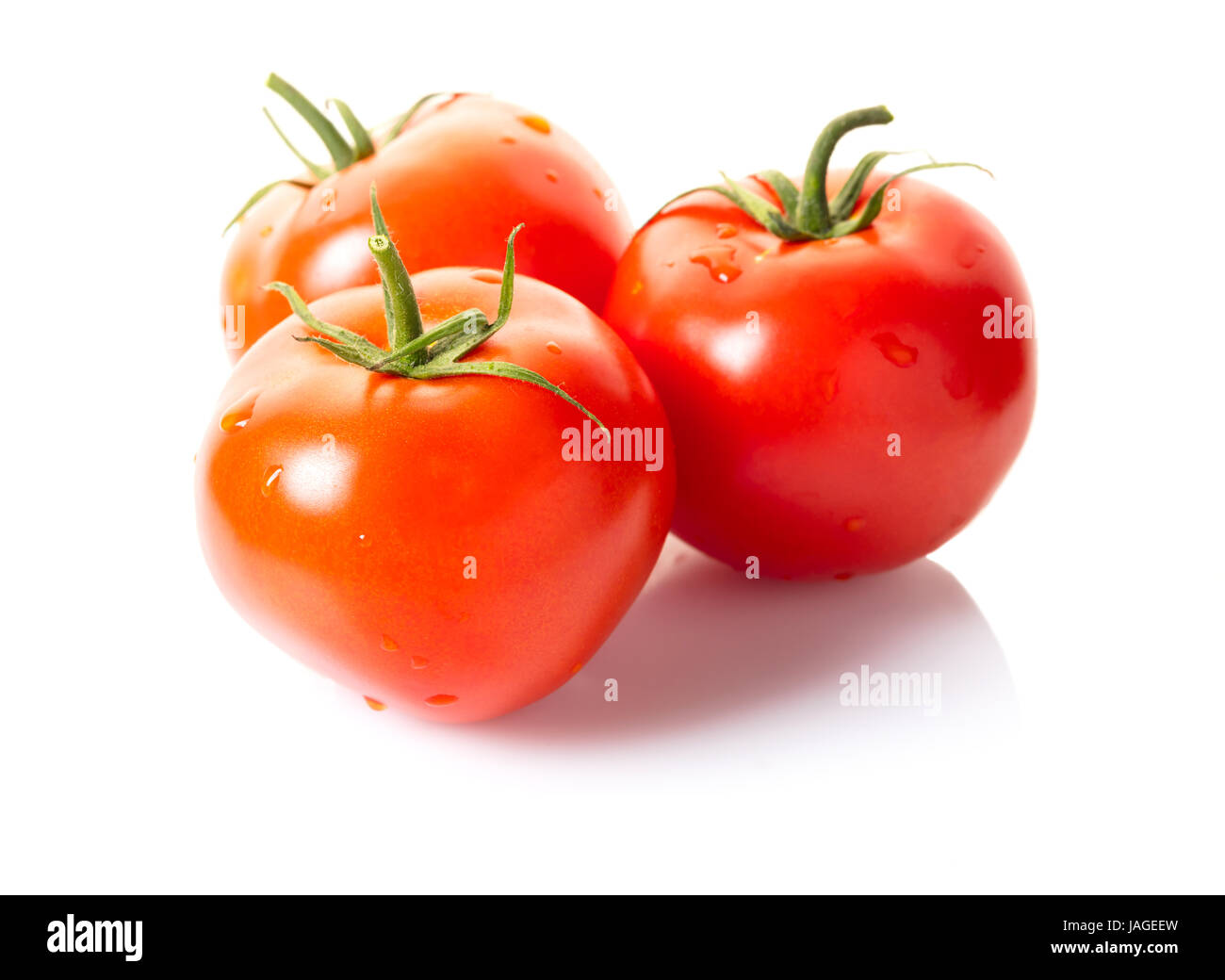 Ripe tomatoes with water drops on white isolated background Stock Photo ...