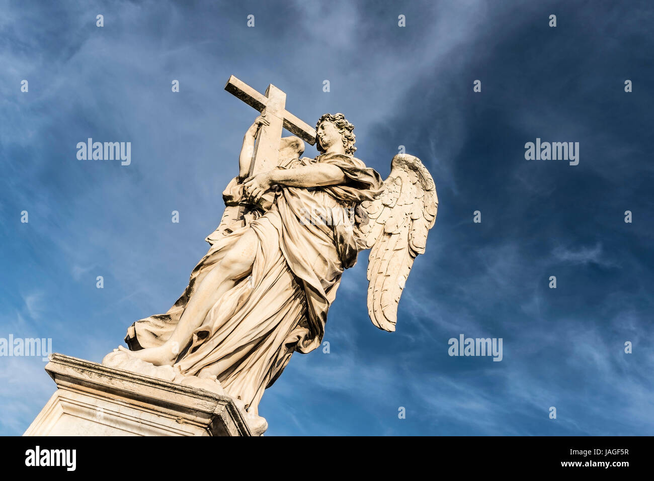 Statue of an Angel with cross on the Pont Sant Angelo, Rome, Italy Stock Photo