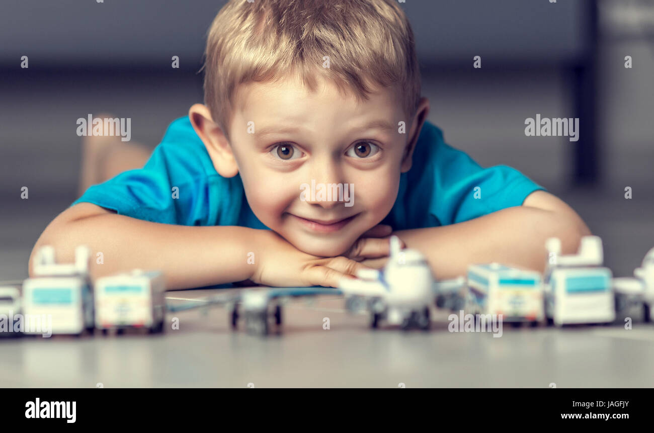 portrait of young kid and toys selective focus Stock Photo