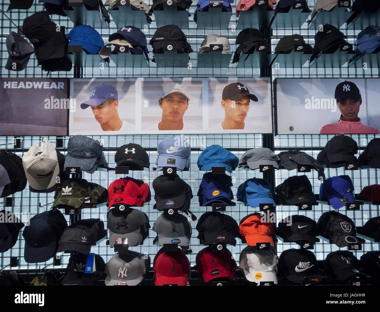 Baseball caps in JD Sports store. UK Stock Photo